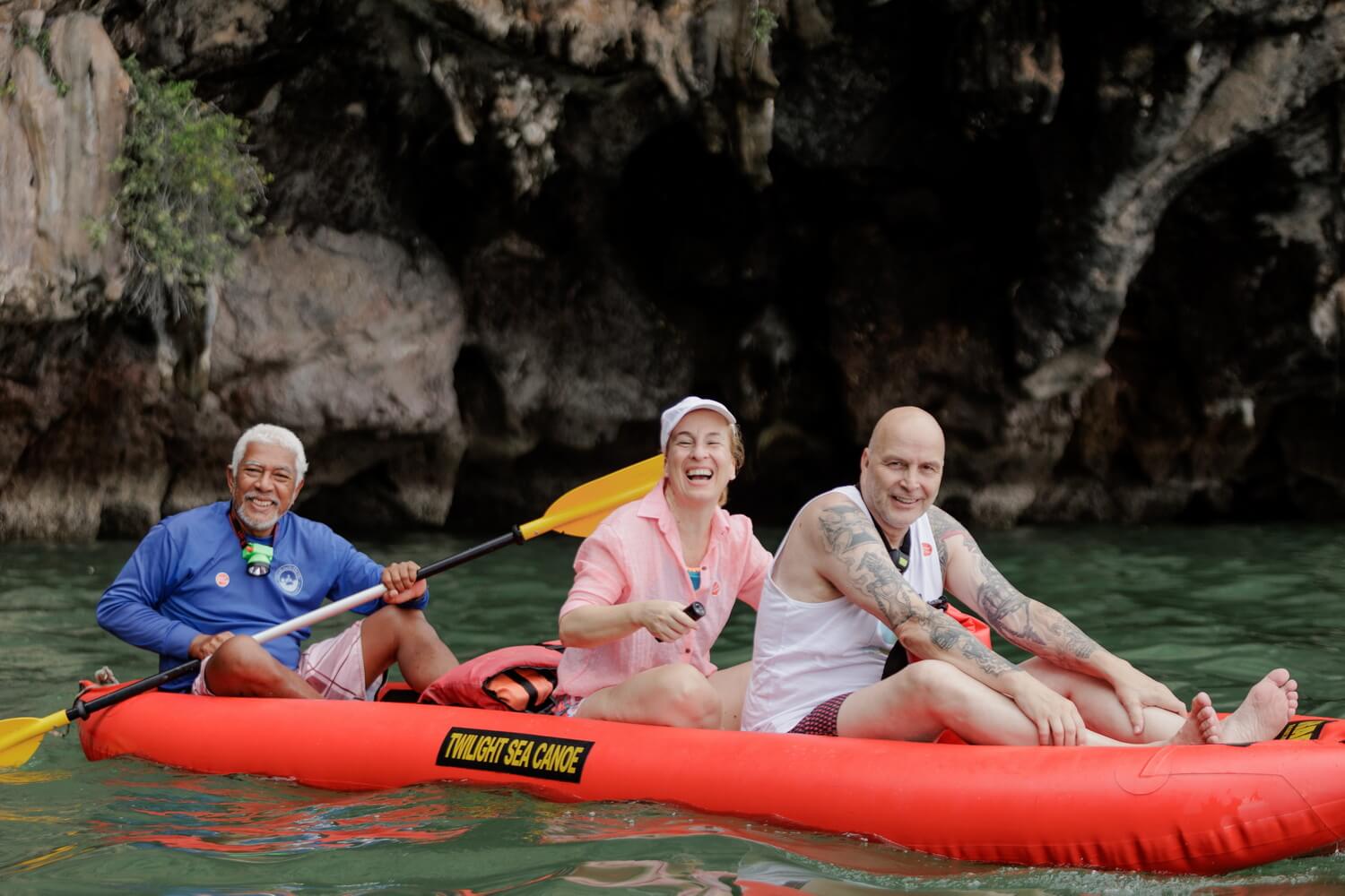 Guests paddling through a sea cave